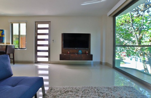 Gonzalo Guerrero Condo | Modern Condo w/ Large Private Patio on 5th Avenue. 4 min. Walk to the Beach!
